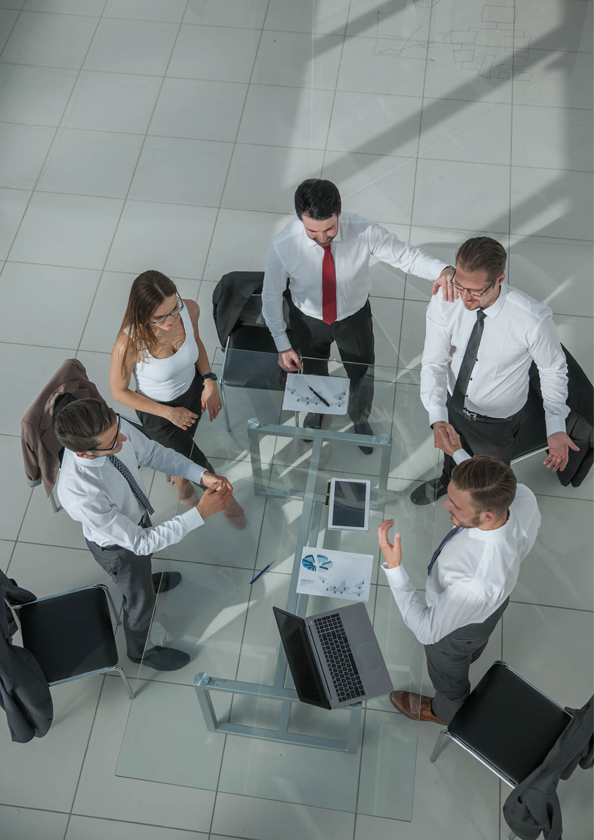 Portrait of smiling business people sitting at conference table in office