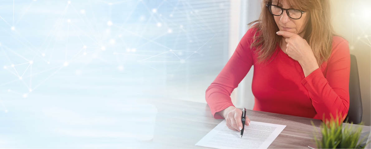 Businesswoman checking document in office; panoramic banner