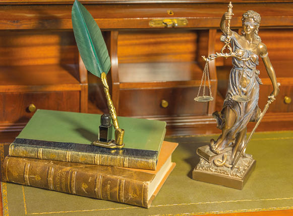 statuette justice with book for law firm