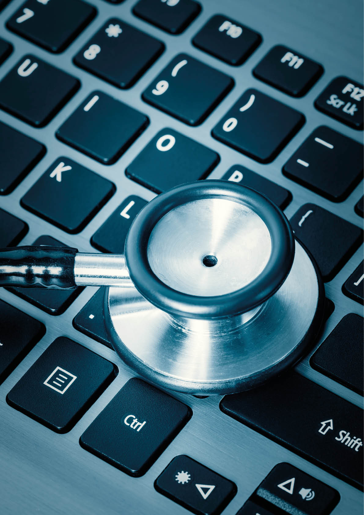 Computer or data analysis - Stethoscope over a computer keyboard toned in blue