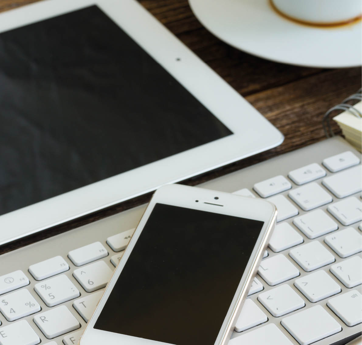 view of  office workplace - phone with  on blank screen on keyboard
