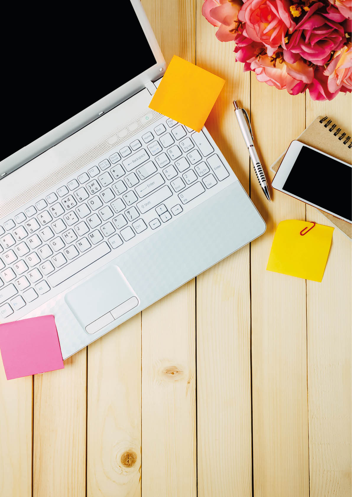 Top view notebook,black coffee,flower, Laptop,stationary,pen,on office desk background 