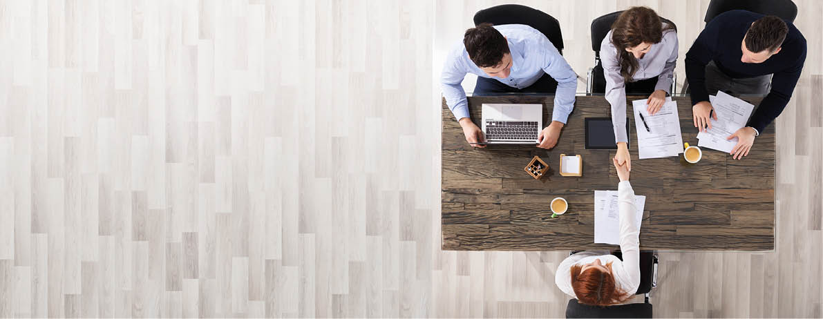 Group Of Corporate Recruitment Officers Shaking Hand With Candidate Arrived For Interview