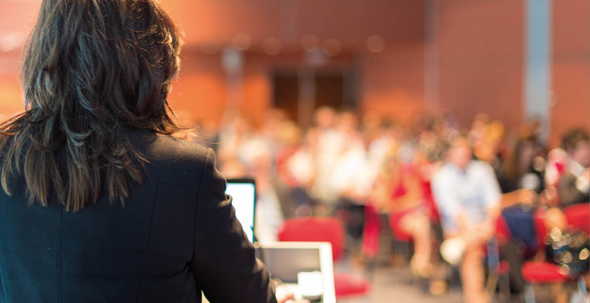 Business woman lecturing at Conference  Audience at the lecture hall 