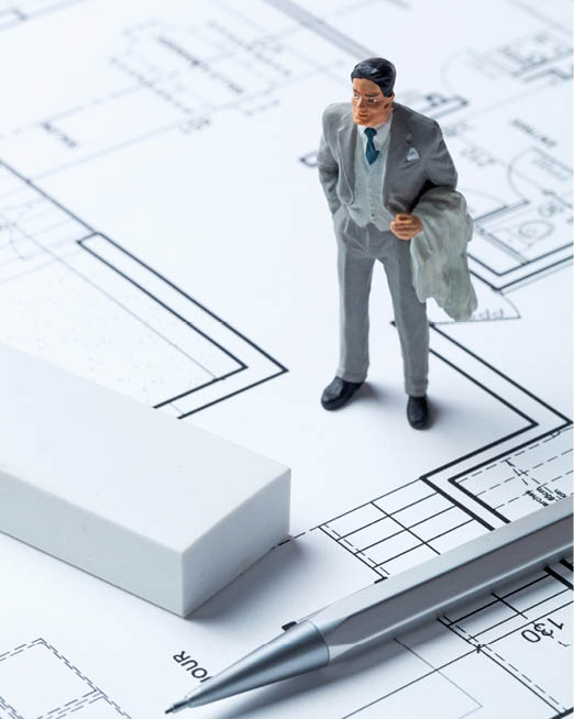 real estate businessman miniature with eraser and pencil on architect blueprint for concept of housing market