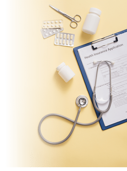 Doctor's stethoscope with patient form and bottle of pills on the desk