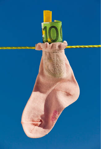 baby socks on clothesline with euro banknotes  blue sky 