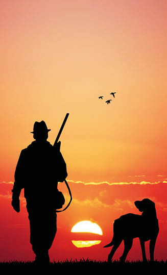 hunter with dog at sunset