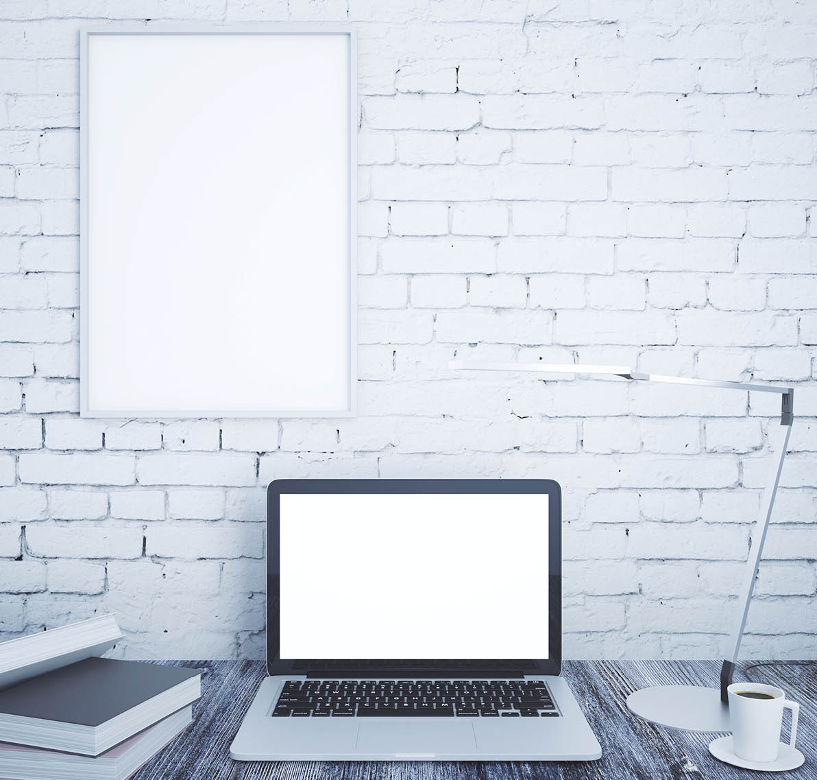 Creative designer desktop with blank white laptop, books, coffee cup, table lamp and blank picture frame on brick wall background  Mock up, 3D Rendering