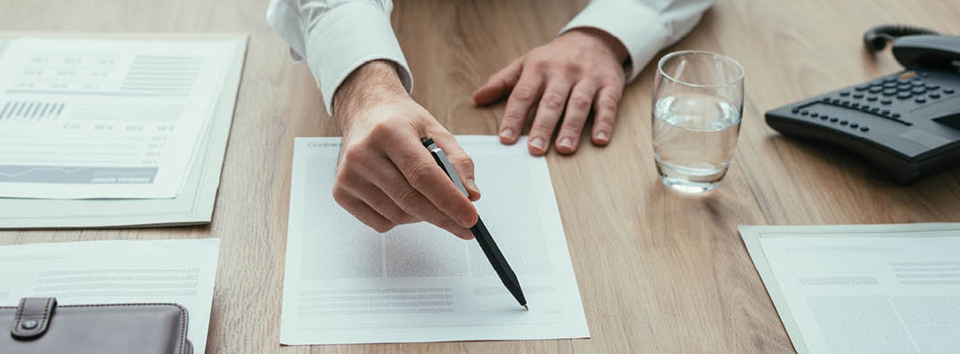 Businessman showing a contract to the customer before signing it, agreement and partnership concept