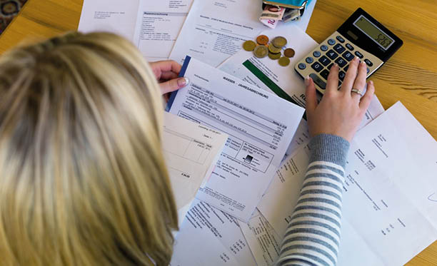 a woman with unpaid bills has many debts  unemployment and personal bankruptcy