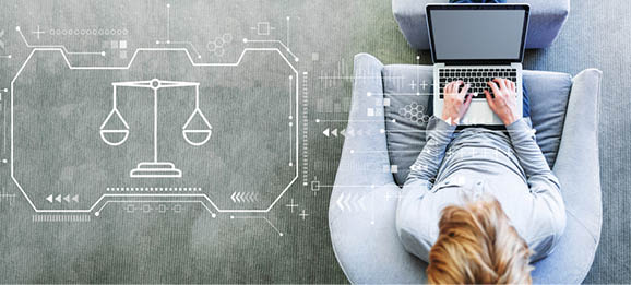 Justice theme with man using a laptop in a modern gray chair