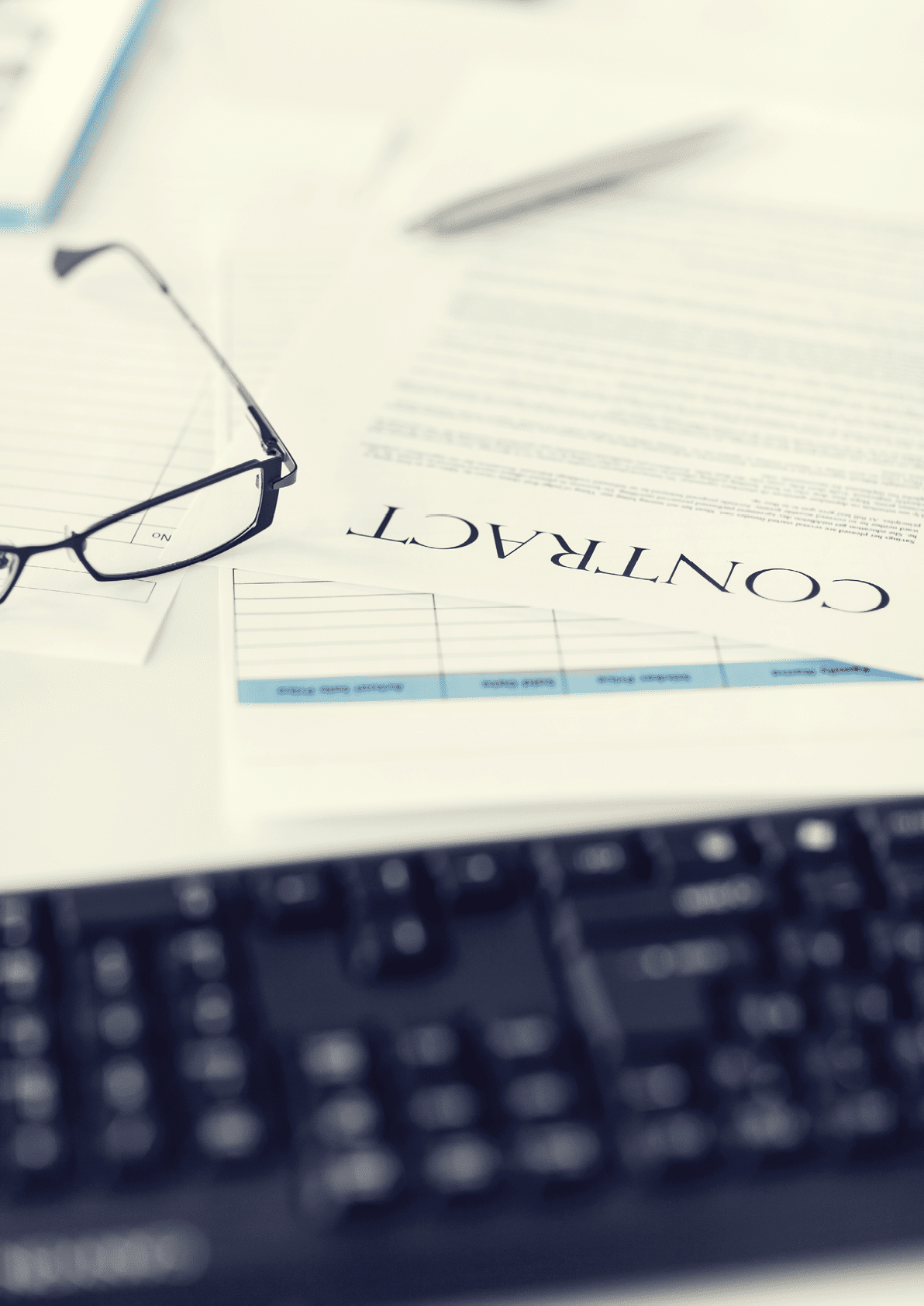 picture of signed contract paper with glasses