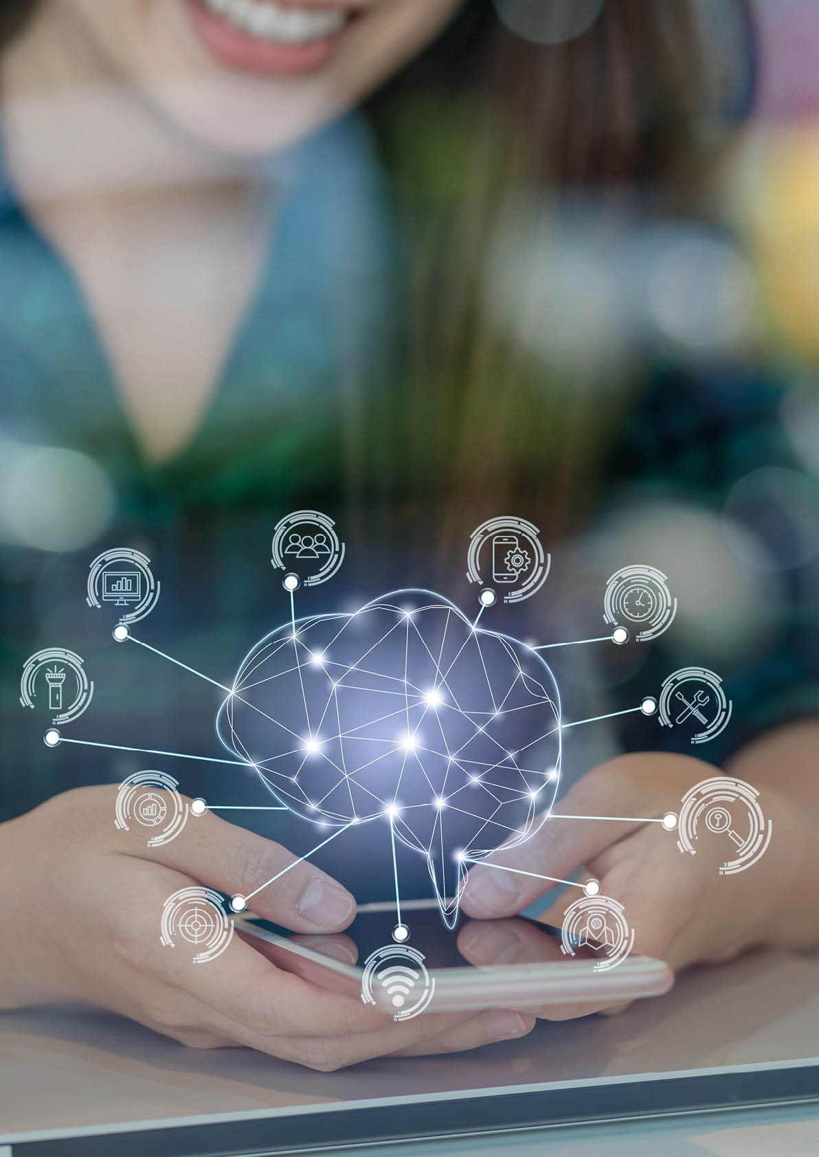 Polygonal brain shape of an artificial intelligence with various icon of smart city Internet of Things Technology over Asian businesswoman hand using the smart mobile phone,AI and business IOT concept