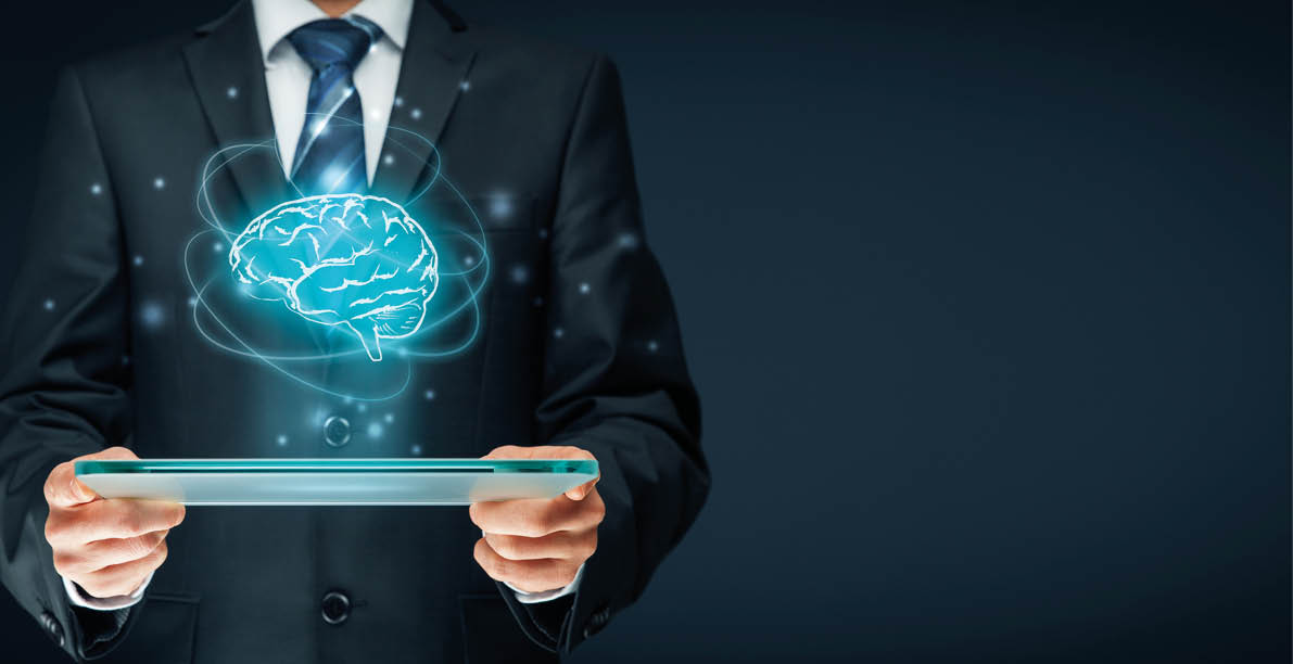 Artificial intelligence (AI), machine deep learning, data mining, expert system software, and another modern computer technologies concepts  Brain representing artificial intelligence and businessman holding futuristic tablet 