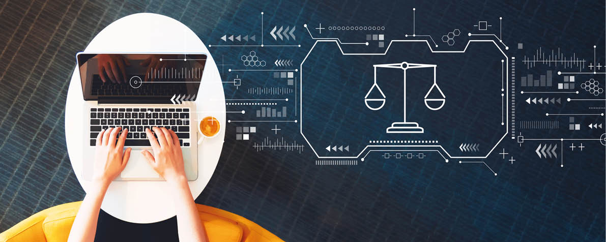 Justice theme with person using a laptop on a white table