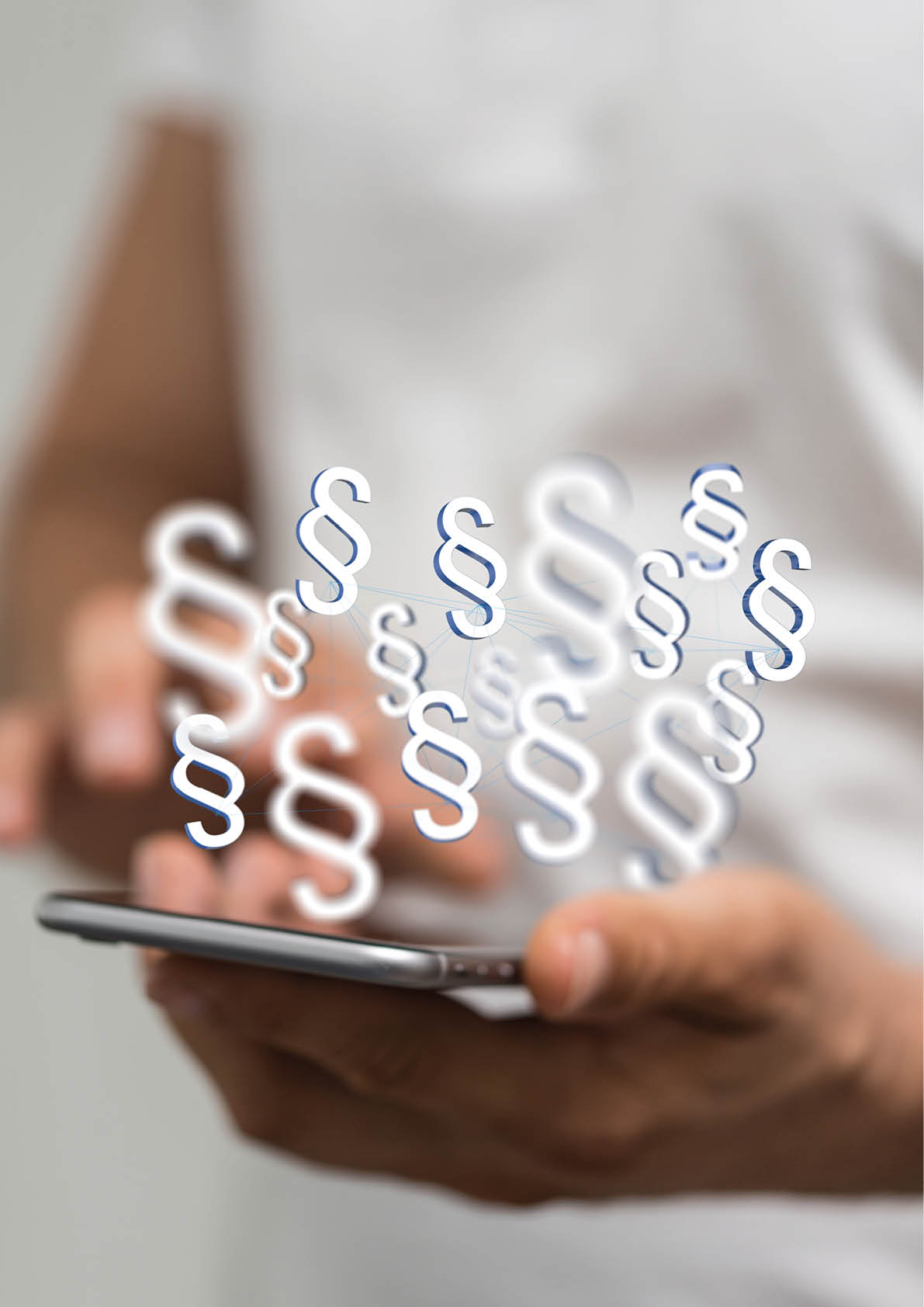 A vertical shot of a human hand holding the virtual projections of digital paragraph law symbols