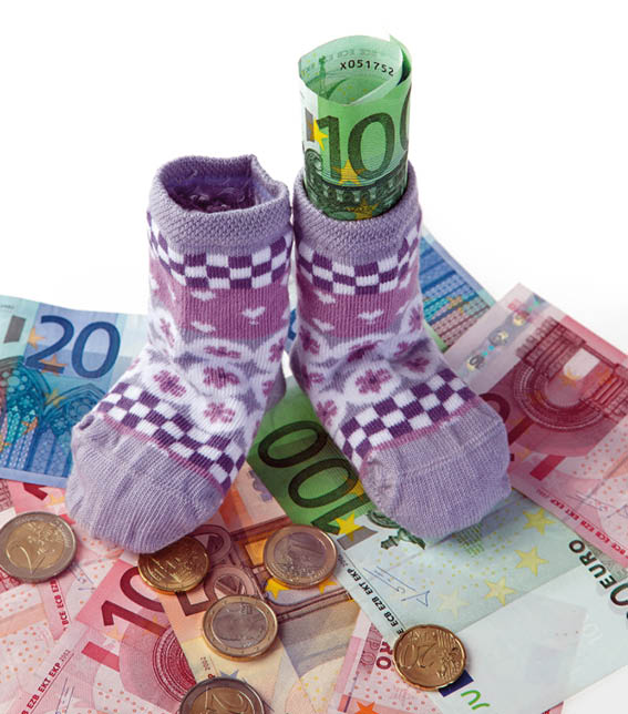 children's socks and euro bank notes  child support and aid deliveries