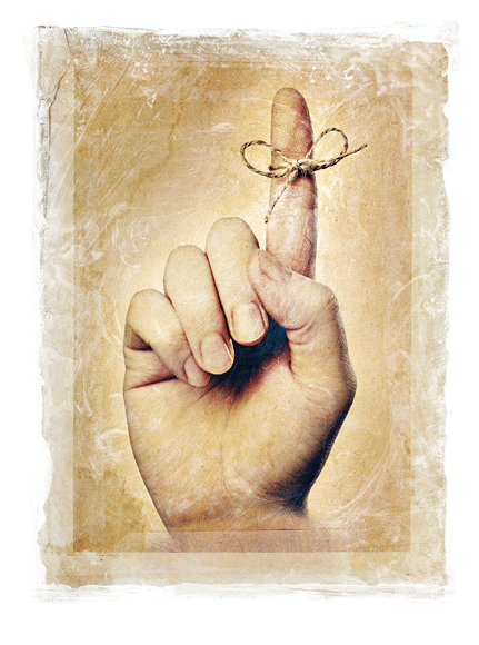 Stained, grainy and gritty image of a hand with a string tied around index finger 