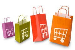 Las modificaciones en la nueva Ley de Consumidores centran la seguridad del comercio electrónico Varias bolsas de colores con un carrito dibujado