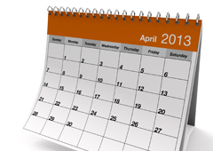 Un calendario de mesa gris y naranja del mes de Abril (en inglés)