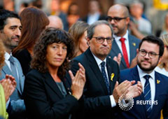 El presidente catalán, Quim Torra, y miembros de su gobierno durante una ofrenda floral durante la Diada, el 11 de septiembre de 2018