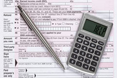 Nuevas retenciones del Impuesto sobre la Renta 2015 Un documento, un bolígrafo y una calculadora