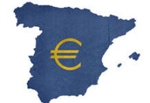 El concierto económico en escena Símbolo del euro sobre un mapa de España