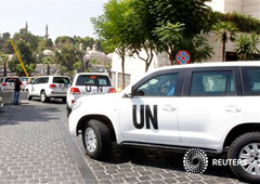 Vehículos de la ONU en las calles de Damasco el 26 de agosto