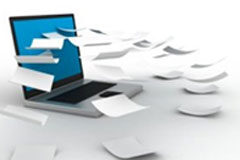 Documentos (electrónicos) en peligro de extinción Portátil y papeles