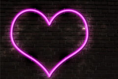 Penas entre 4 y 22 años de prisión por obligar a prostituirse a tres mujeres en Valencia Un corazón de neón sobre una pared