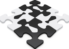 4 fichas de puzzle unidas, dos blancas y dos negras cada una con el dibujo de una corbata