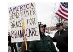 Un manisfestante con pancartas