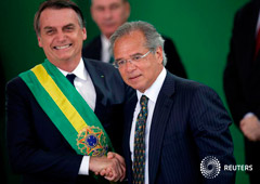 Foto de archivo del presidente de Brasil, Jair Bolsonaro, y el ministro de Economía, Paulo Guedes, en el Palacio de Planalto en Brasilia. Ene 1, 2019.