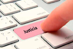 El Ministro de Justicia participa en la conferencia “Modernización y Agilización de la Justicia Española” Un dedo pulsando una tecla de ordenador