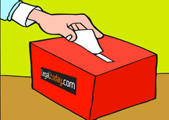 Alguién votando en una urna, la cual lleva el logo de legaltoday.com