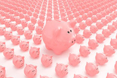 Cómo afrontar la sucesión de un despacho y conseguir que sea un éxito Una hucha rosa de cerdito grande rodeada de varias pequeñas.