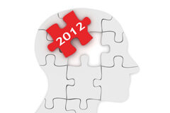 El secreto: reflexiones estratégicas para empezar el año con buen pie La figura de una cabeza dibuajada con piezas de puzzle y una de ellas es roja con el número 2012
