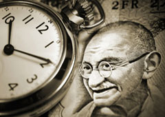 Imagen de Ghandi y un reloj Imagen de Ghandi y un reloj