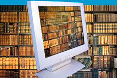 Papel cero en la Administración de Justicia… ¿papel cero en los despachos de abogados? Una libreria llena de libros y un portátil