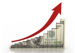Un gráfico hecho con billetes de dólar que va en incrementoy una flecha roja hacia arriba