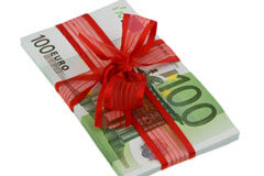 El IVA en los cheques regalo Billetes de cien euros con un lazo rojo