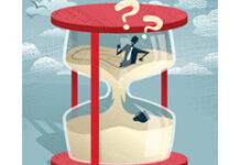 La cobertura de las vacaciones para los contratados temporales Trabajador atrapado en un reloj de arena