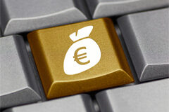 Todo tiene un precio en Internet Dibujo de un saquito con el símbolo del euro en una tecla de ordenador