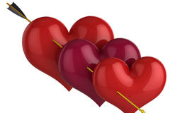 ¿Es indemnizable la infidelidad? Tres corazones de color rojo atravesados por una flecha.