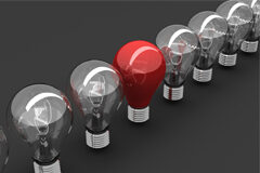 Novedades Fiscales para el 2011 En un fondo gris una fila de bombillas y en medio de ellas una roja