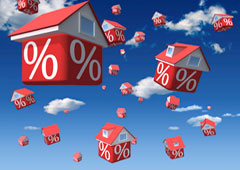 Casas rojas volando con el símbolo del %.