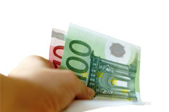 ¿Es el interés de demora un gasto deducible en el Impuesto sobre Sociedades? Un mano con dos billetes