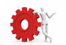 La reforma laboral que no cesa Rueda engranaje y un muñeco